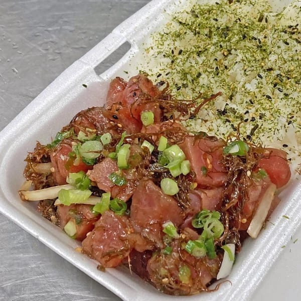 Poke Etc's poke bowl with marinated tuna, seaweed, green onions, and rice topped with furikake.