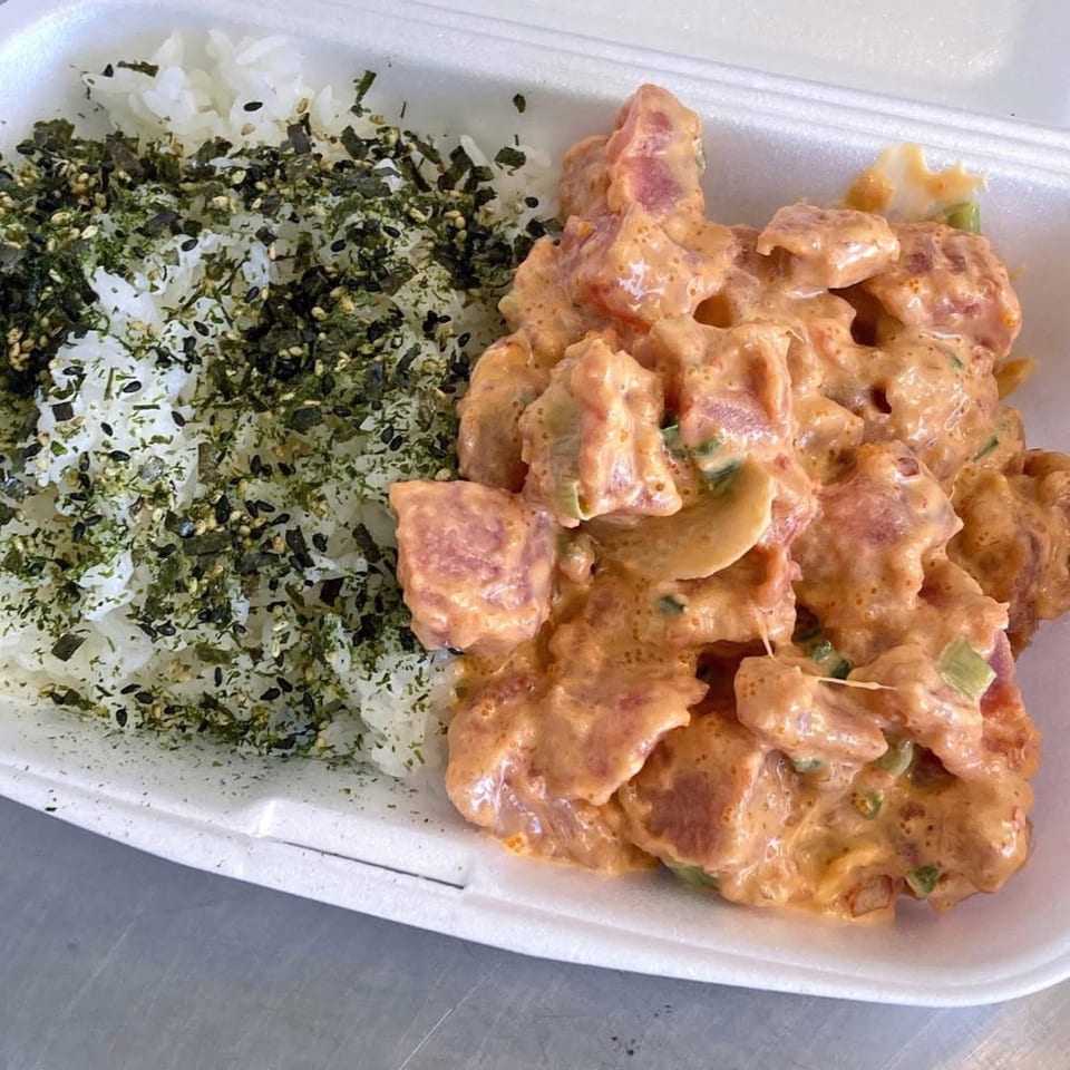 Poke Etc's spicy poke bowl with white rice topped with furikake and creamy orange poke.